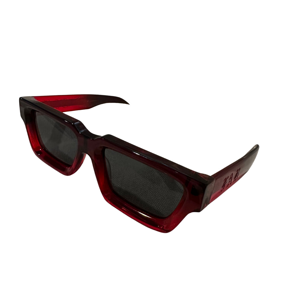 Side profile of Triton sunglasses featuring angular red and black frame with dark lenses